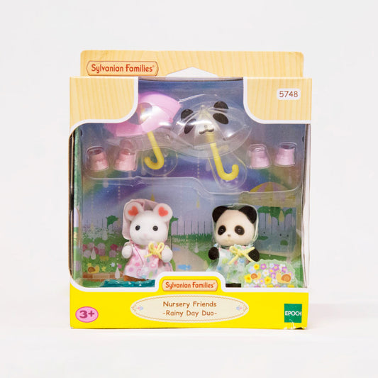 Sylvanian Families Dúo Rainy Day Bebés con impermeable y sombrilla
